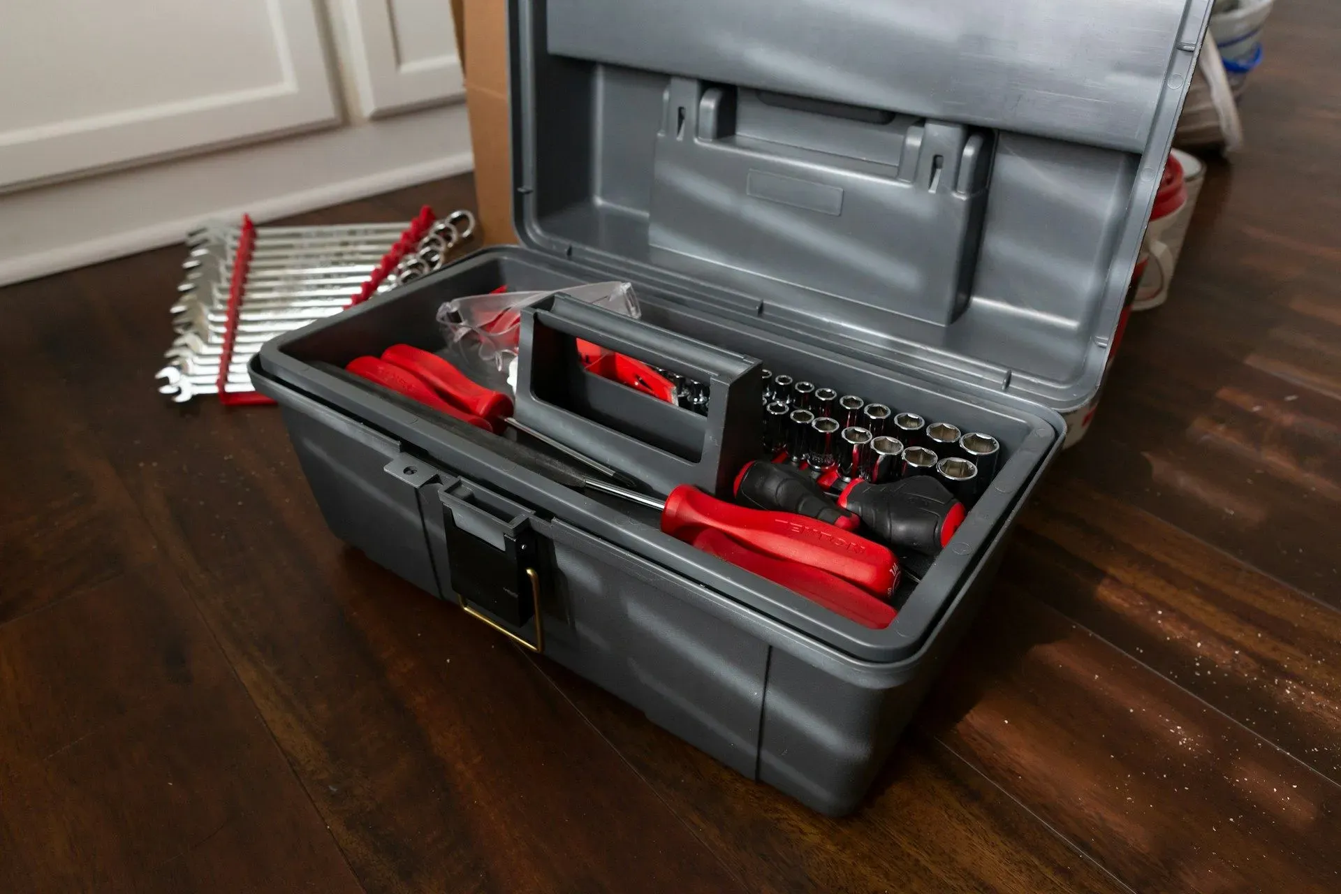 Car emergency tool kit box prepared for road trip safety.